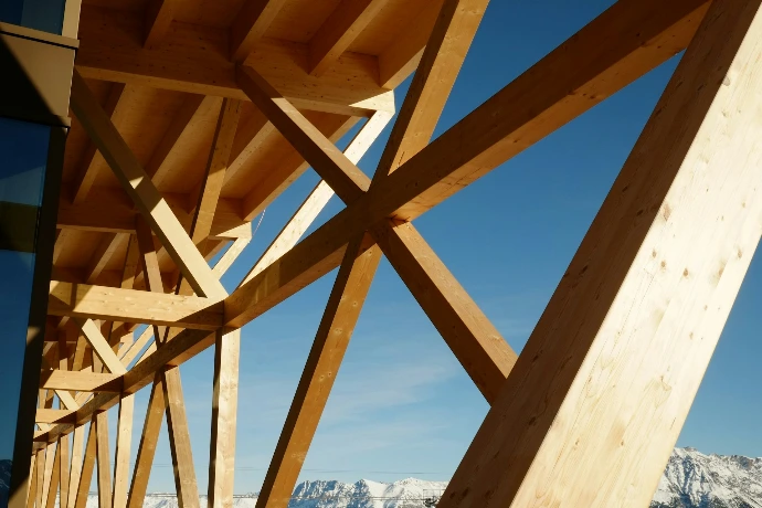 A wooden bridge with mountains in the background